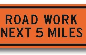 Road work next XX miles sign
