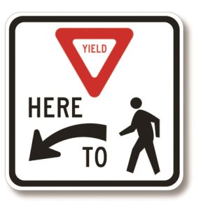 Yield here to pedestrians (left arrow)