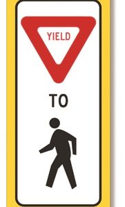 Yield to pedestrians within crosswalk sign