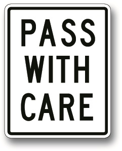 Pass with care sign