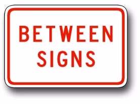 Between signs sign
