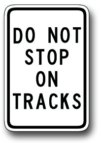 Do not stop on tracks sign